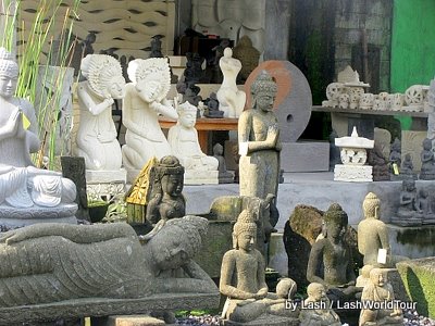 carved stone statues along the Batuan-Ubud road