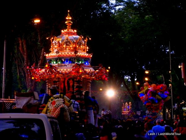 Thaipusam's silver chariot illuminated at night