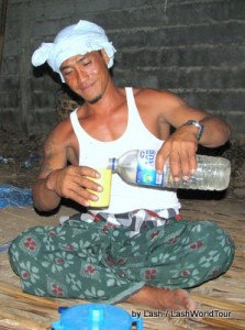 Balinese guy pouring arak