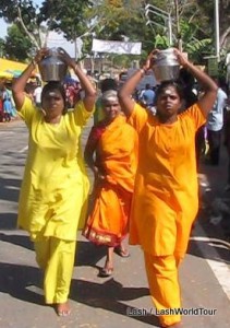 Indian women carrying pots of milk