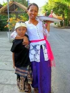 Balinese woman with her son - heading to ceremony
