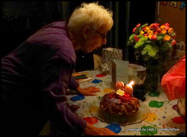 mom blowing out 80th candles