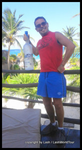 party at Tulum beach with giant vodka bottle 