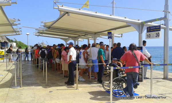 crowded ferry terminal to Isla Mujeres