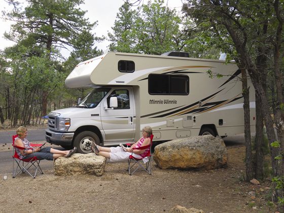 Apollo RV rental - women relaxing at camp