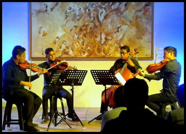 classical orchestra performance at Casa de Tres Mundos