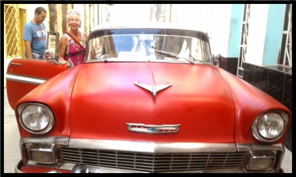 getting ready for a road trip in a Vintage car in Havana
